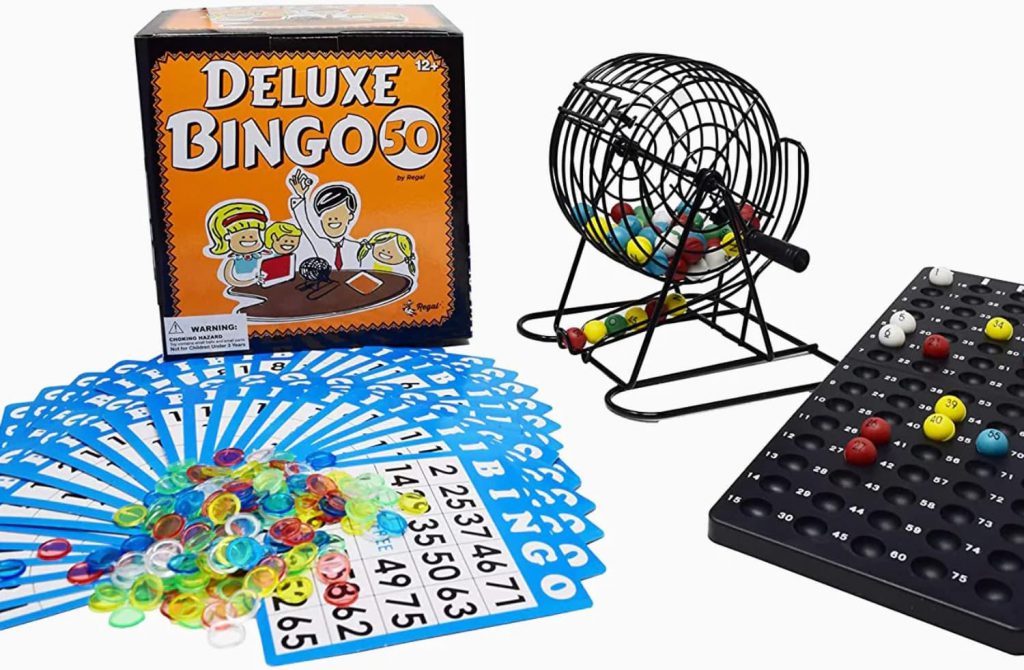 Image of the Regal Deluxe Bingo Set. This image included pictures of the Regal Bingo Box, 50 Bingo cards, assorted colored bingo chips, a master bingo board and a rotary bingo cage filled with bingo balls.