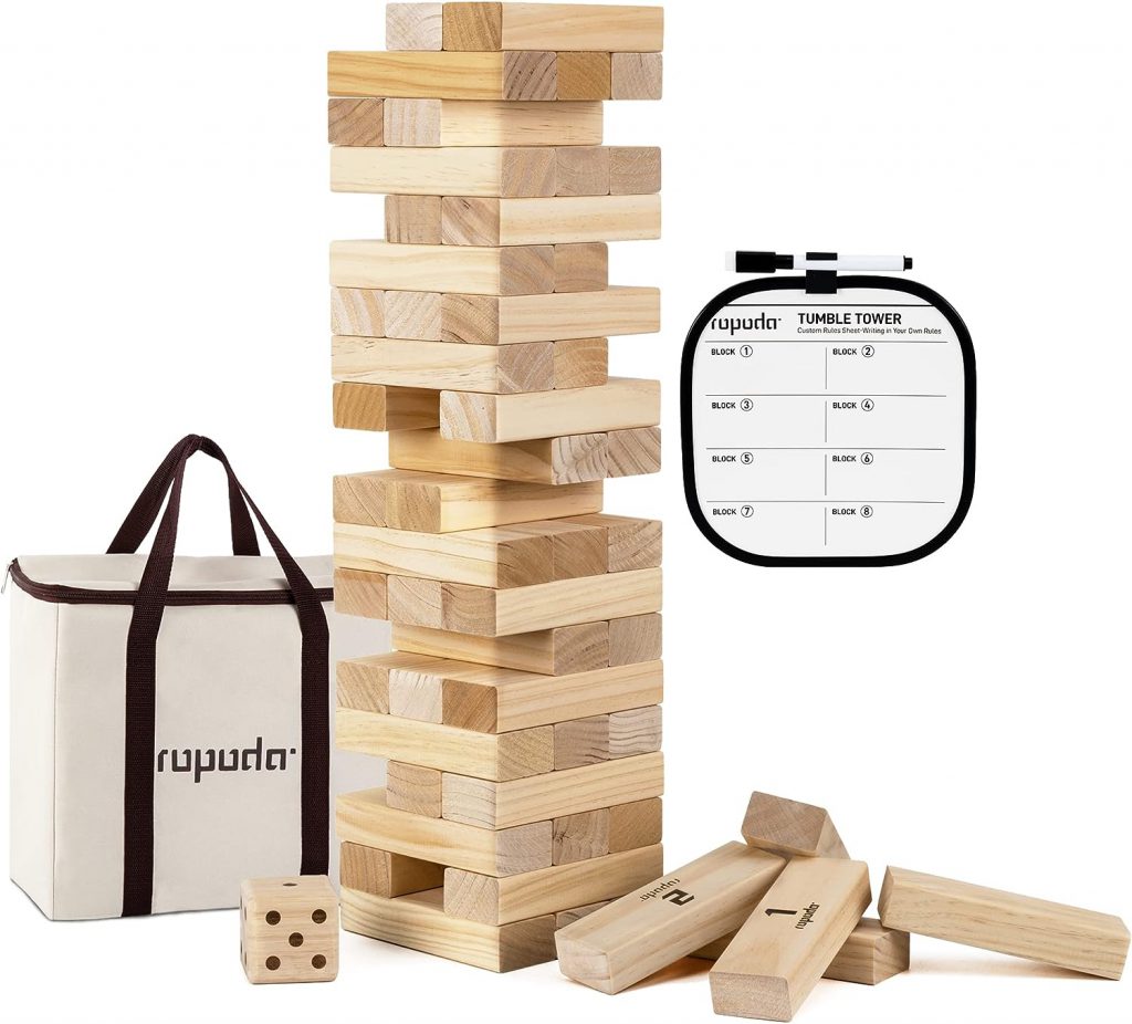 Image of a giant jenga playing set. The image includes a picture of a jenga tower, a carrying case for the jenga game, a large wooden die and a scoring board and dry erase marker.